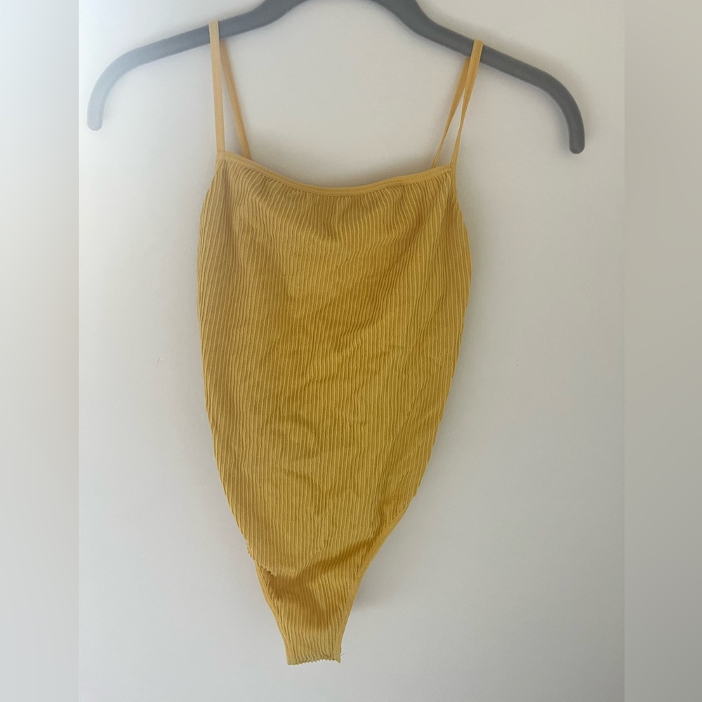 Detailing open back yellow body suit